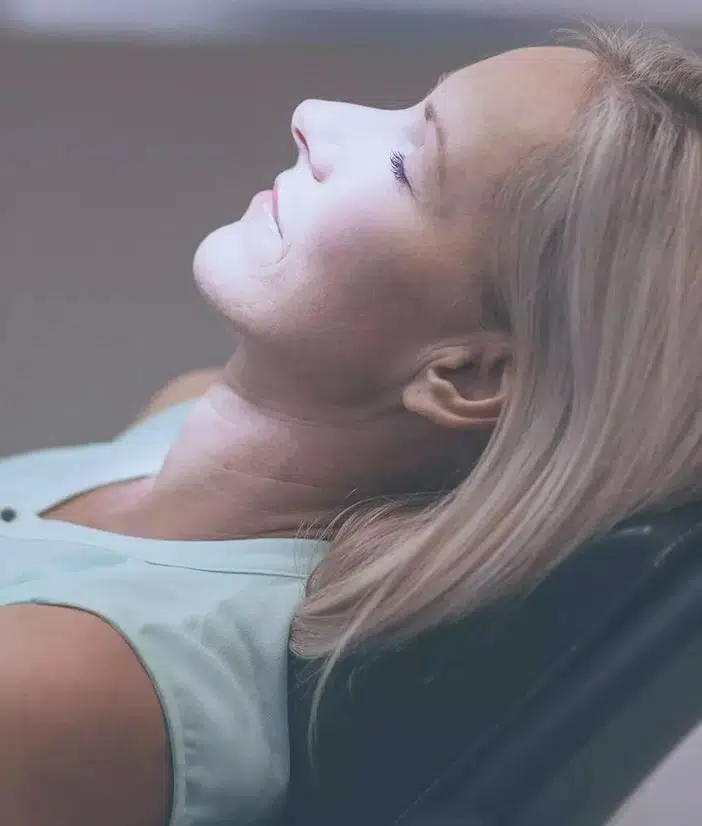 Woman tilted back in dental chair during examination at Market Street Dental Studio.